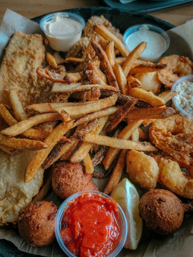 The Gulf Blogs A mouth-watering platter of fried fish, shrimp, and fries with a variety of dipping sauces.